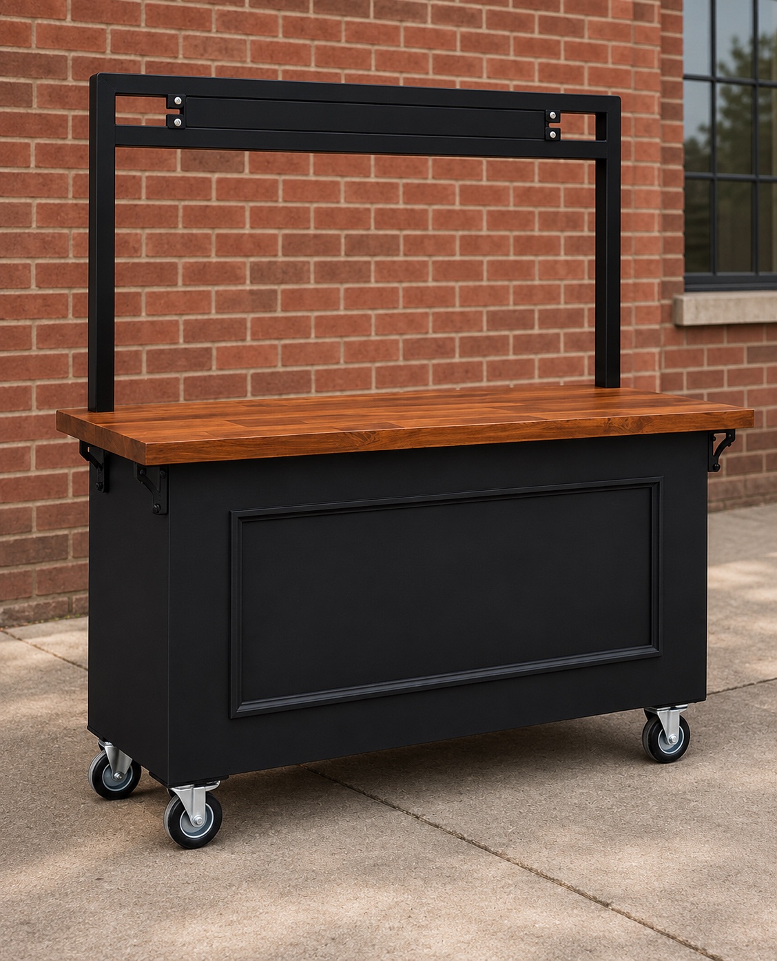 Premium black mobile vendor cart with butcher-block wood top and metal display rack against a red brick wall